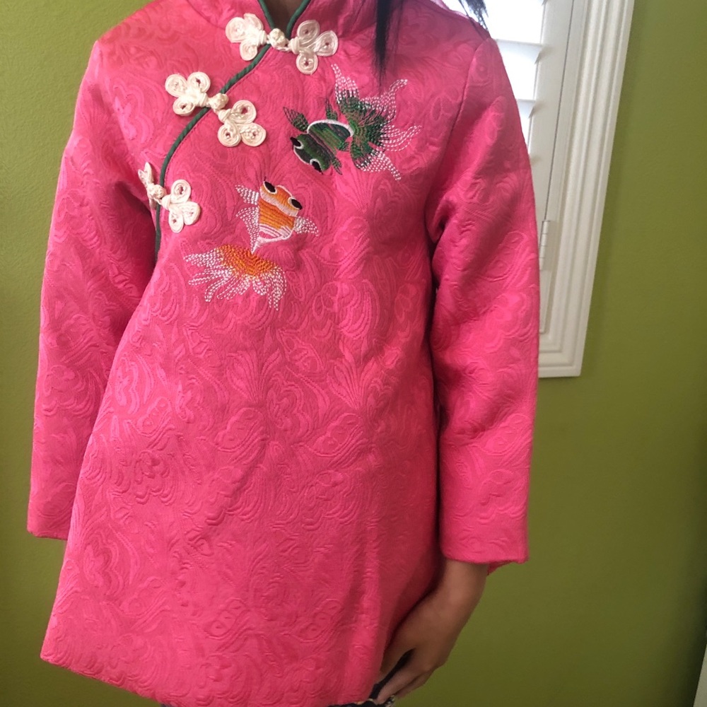 Pink dress with multiple layers inside.